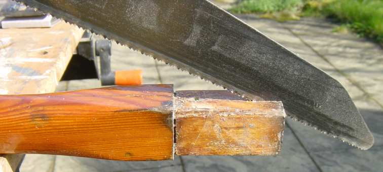 Photo showing opening up split with a saw