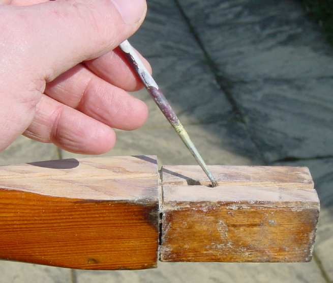 Photo showing application of unthickened Epoxy resin to the split