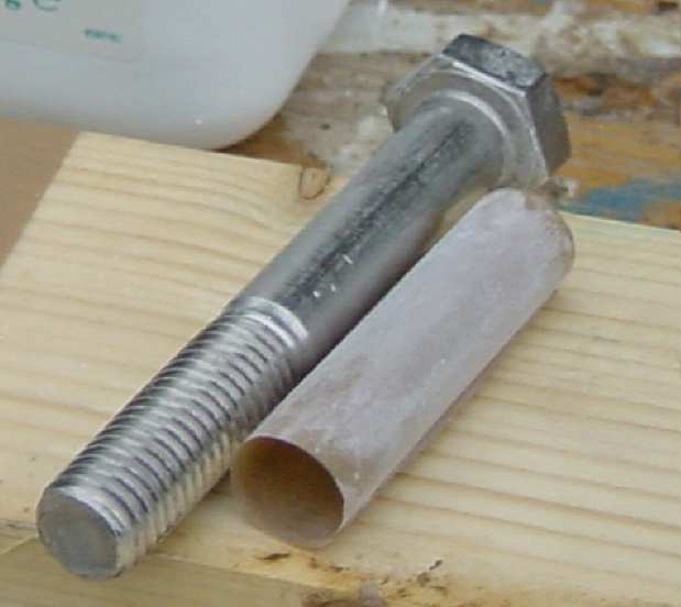 Photo, preparing a plastic sleeve for the bolt
