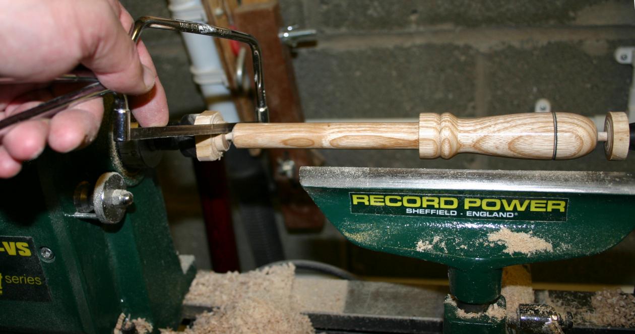 Removing the completed pin from the lathe