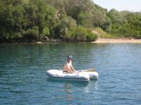 Friday morning 18th September, Tim rowing the dinghy ashore at an anchorage on Meganisi.