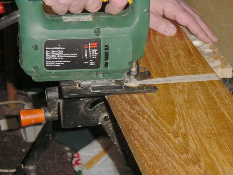 Photograph showing the capping being cut to size with a jig saw