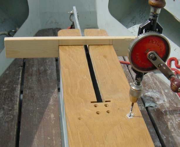 Photo, drilling the fixing holes into the GRP of the centreplate casing