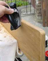 Using a plane to bevel the edges of the capping