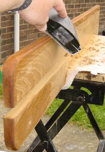 Photo, using a sanding block to smooth the edges of the capping
