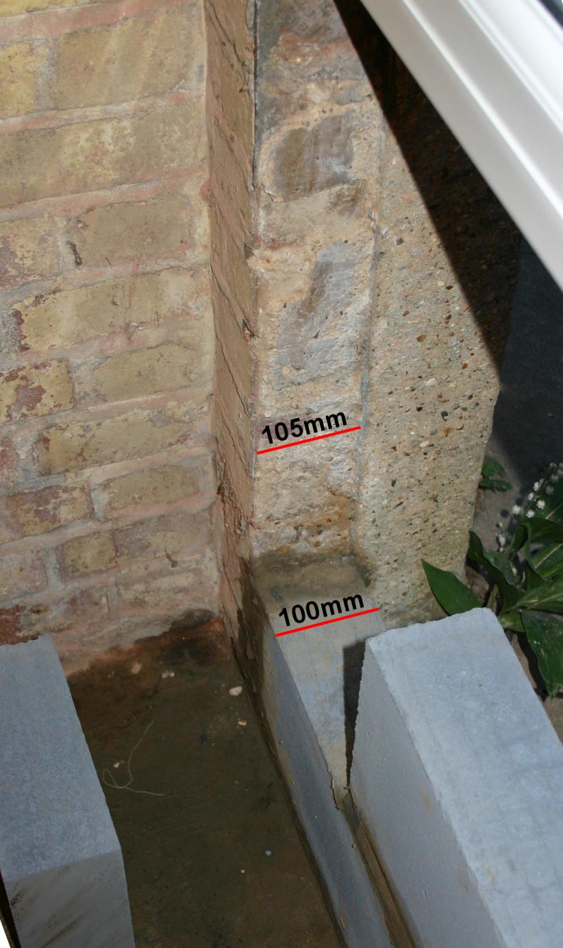 Photograph showing the comparative depth of the blocks & the surrounding bricks.