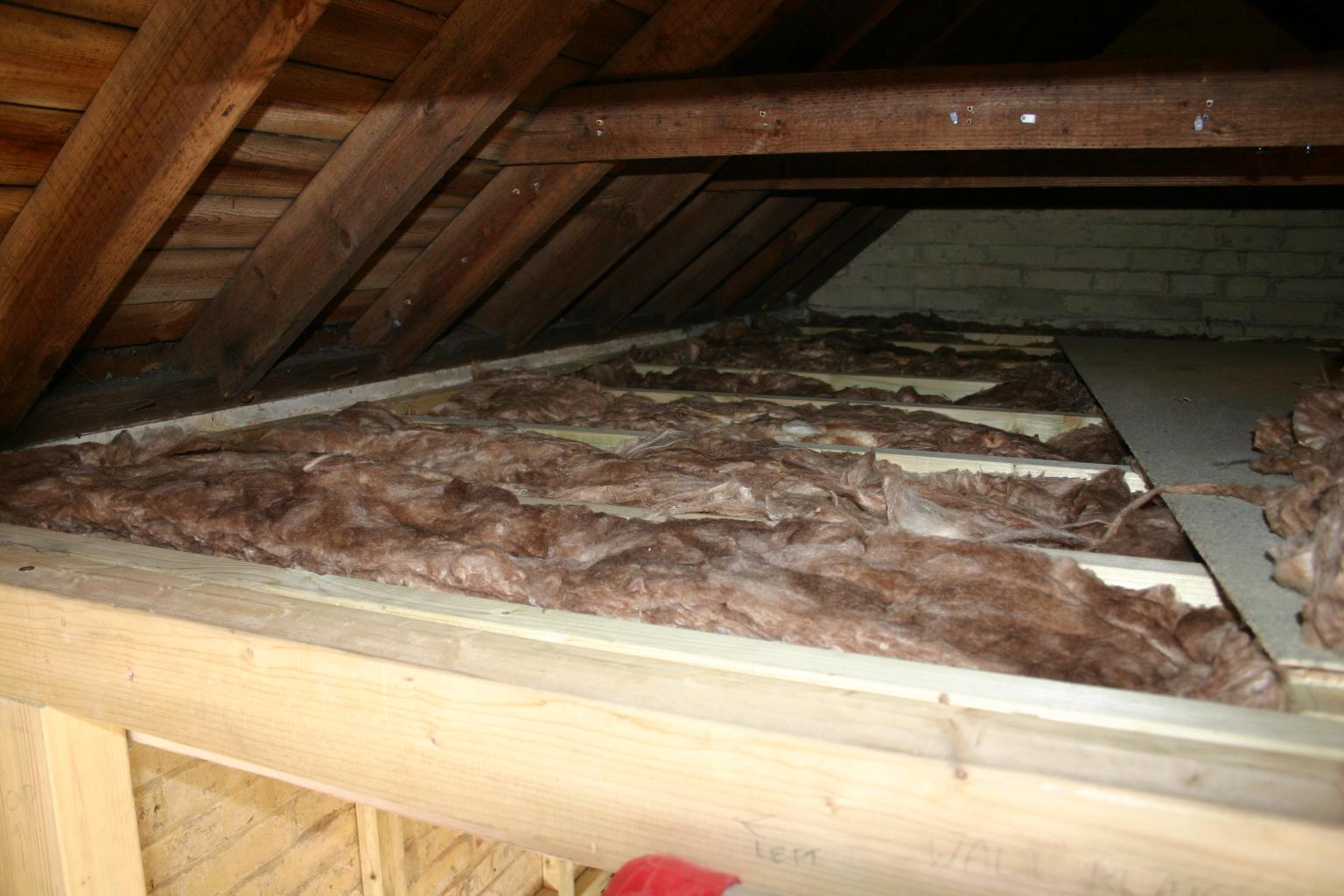Installing loft insulation.