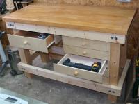 Photograph of completed workbench, drawers in use.