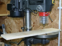 Drilling the plywood base.