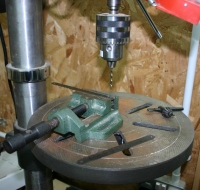 Drilling through a hacksaw blade with a cobalt drill bit.