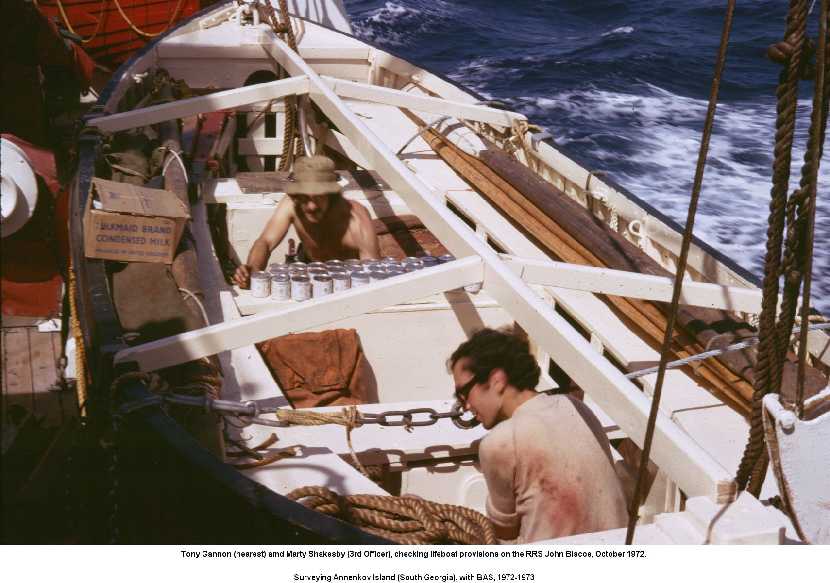 Checking lifeboat provisions on the RRS John Biscoe, October 1972.