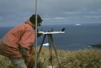 Eric Lawther plane table surveying on Albatross Crest (spot height 126), Annenkov Island. November 1972.