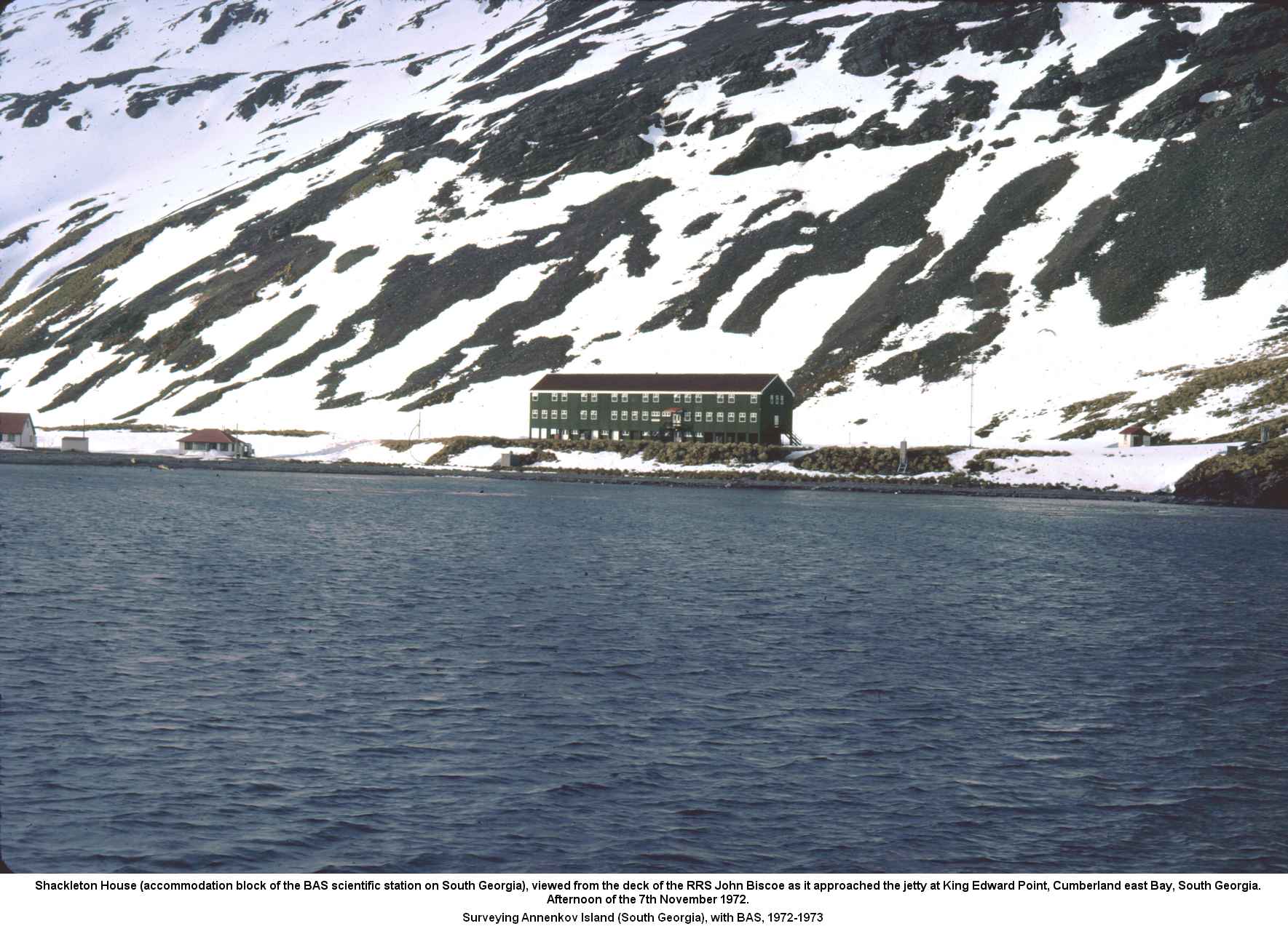 Shackleton House (accommodation block of the BAS scientific station on South Georgia), viewed from the deck of the RRS John Biscoe as it approached the jetty at King Edward Point, Cumberland east Bay, South Georgia.
Afternoon of the 7th November 1972.