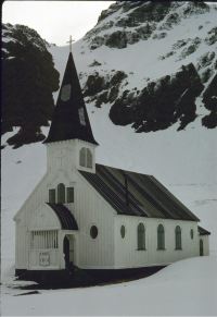 The church at Grytviken, South Georgia. Don Watkins sitting on entrance steps. 9th November 1972.