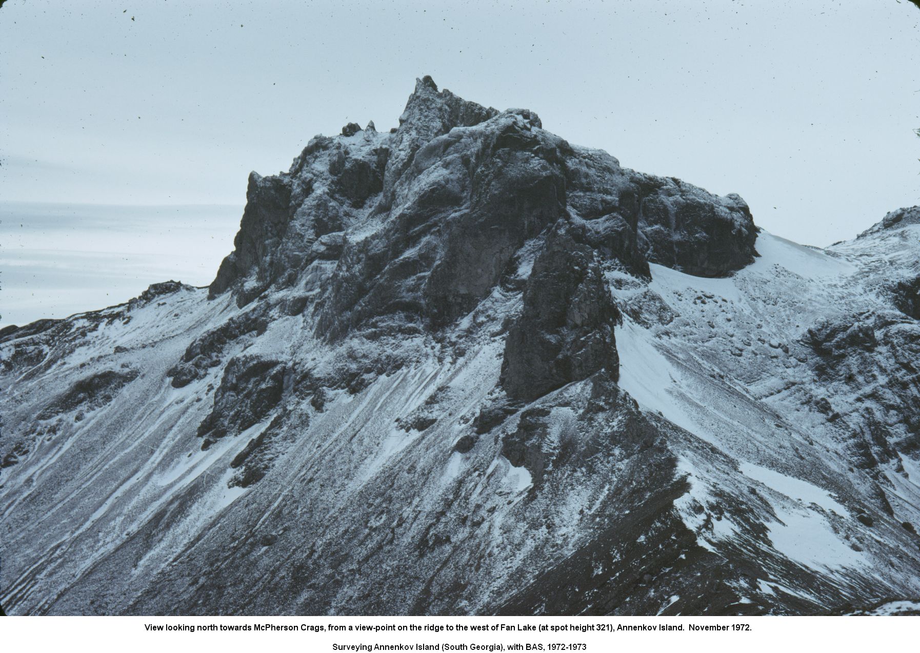 View looking north towards McPherson Crags, from a view-point on the ridge to the west of Fan Lake (at spot height 321), Annenkov Island.  November 1972.