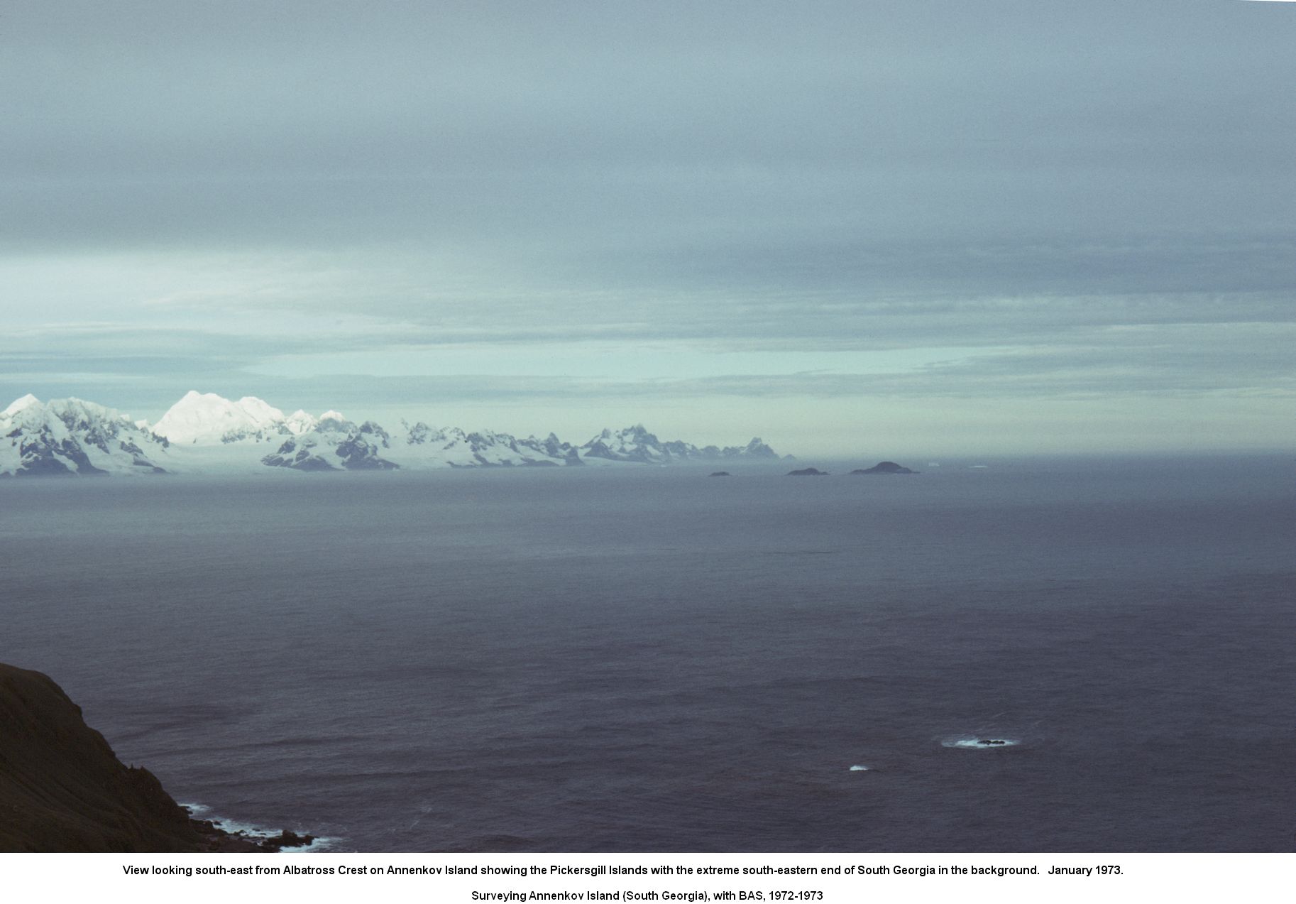 View looking south-east from Albatross Crest on Annenkov Island showing the Pickersgill Islands with the extreme south-eastern end of South Georgia in the background. January 1973.
